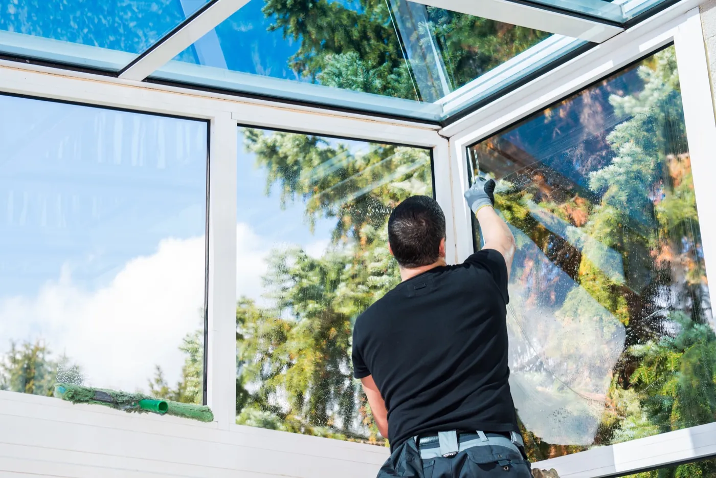 Window cleaner working on a Hitchin property