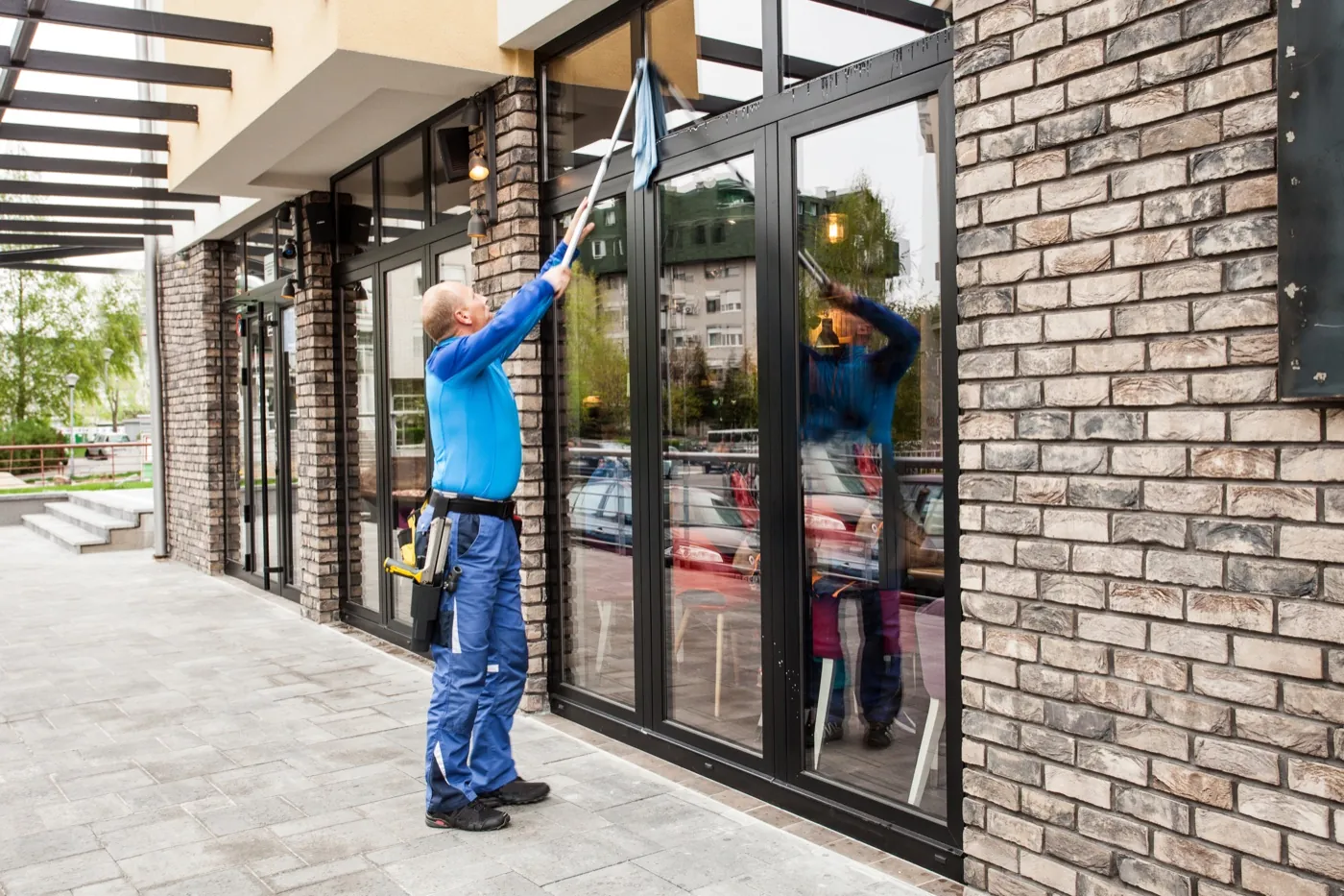 Window cleaner working on commercial glazing in Welwyn Garden City