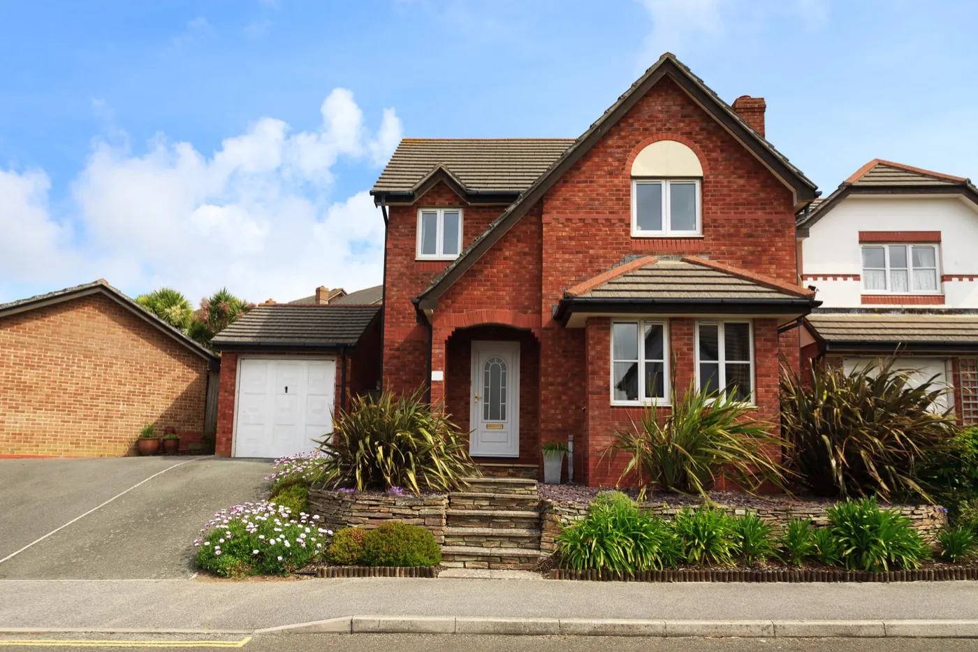 Window cleaning for a red-brick home in Biggleswade